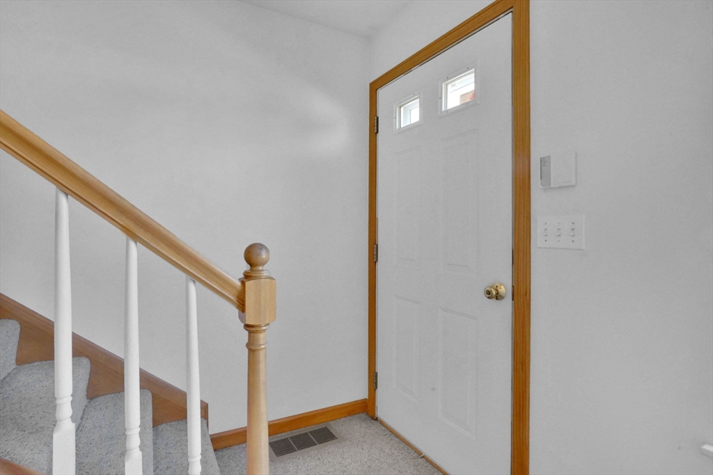 665 Center Street, Unit 705 Ludlow, MA 01056 - Photo 3 of 35 a view of staircase with railing and white walls