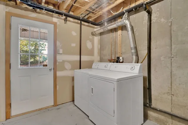 a front view of a building with a garden