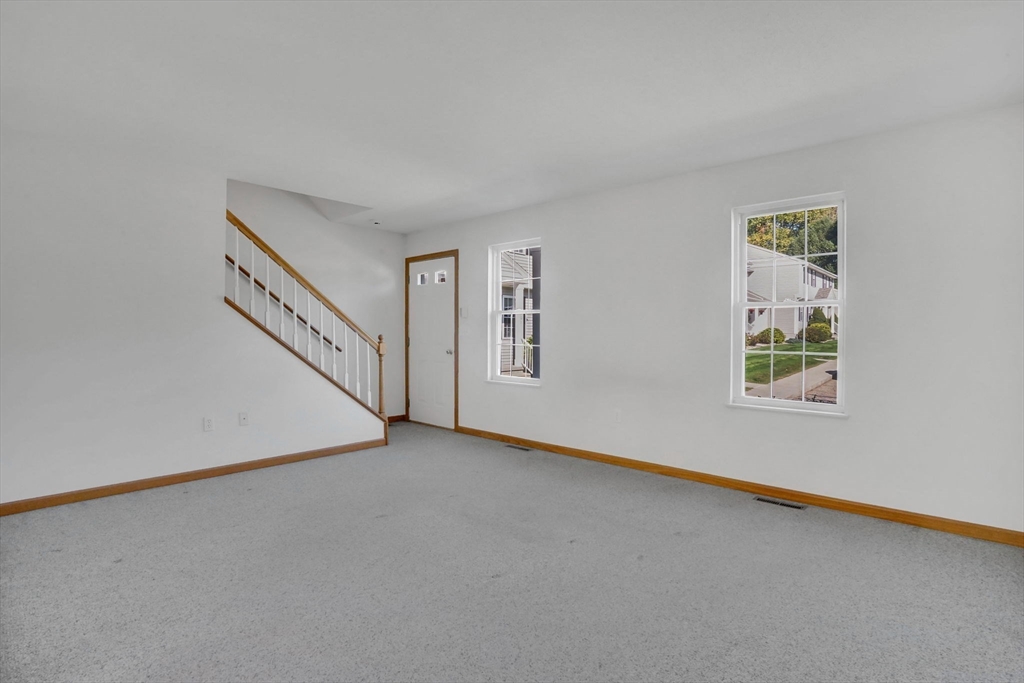 665 Center Street, Unit 705 Ludlow, MA 01056 - Photo 7 of 35 a view of an empty room with windows