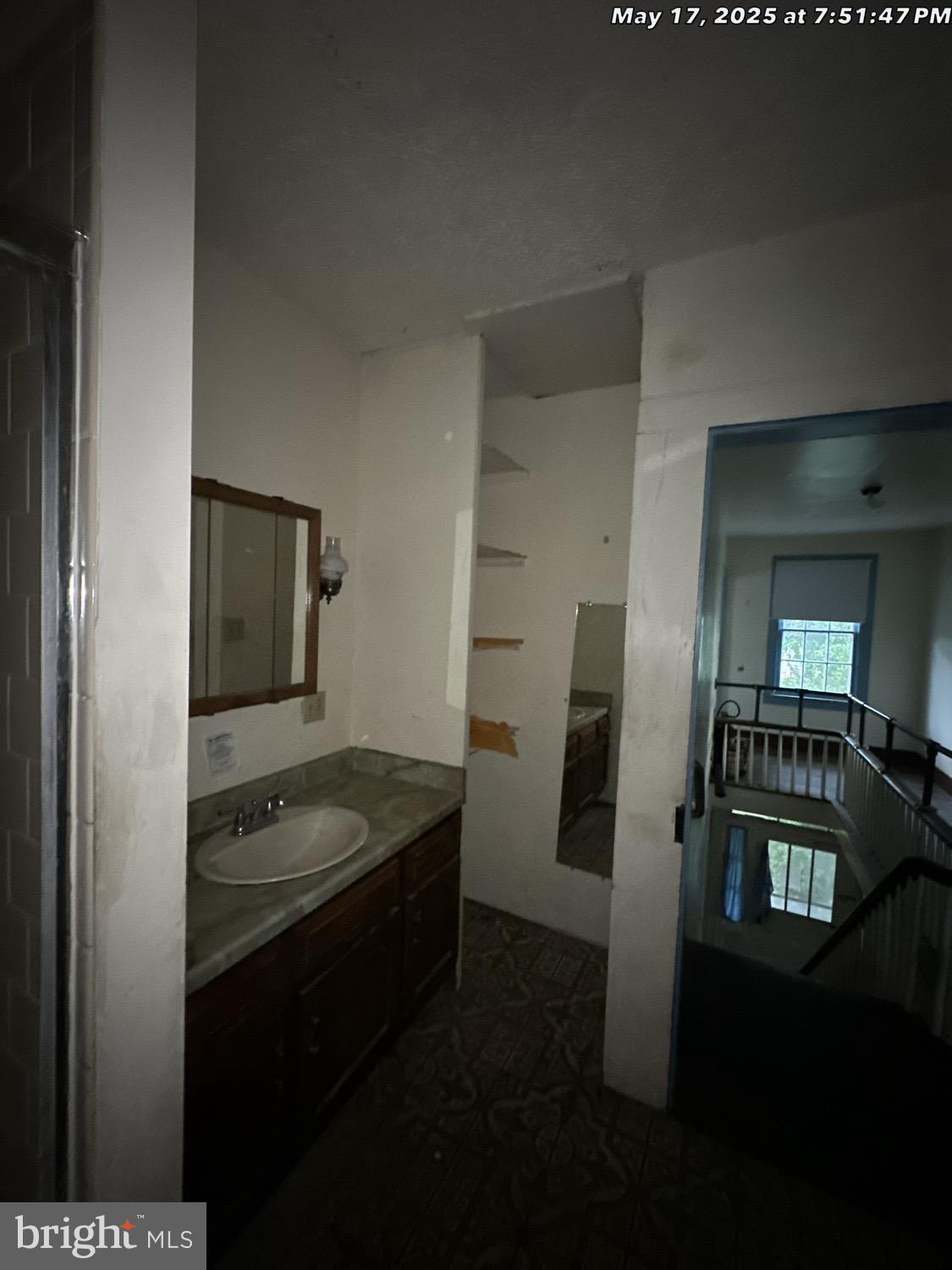 1449 Reliance Road Middletown, VA 22645 - Photo 16 of 23 a bathroom with a granite countertop sink and washing machine