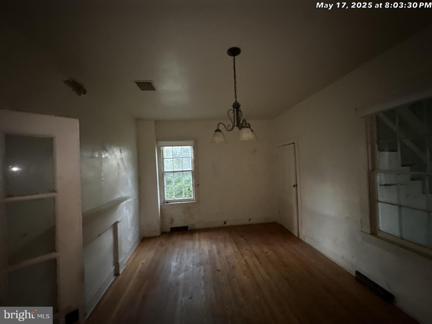 1449 Reliance Road Middletown, VA 22645 - Photo 23 of 23 an empty room with wooden floor and windows