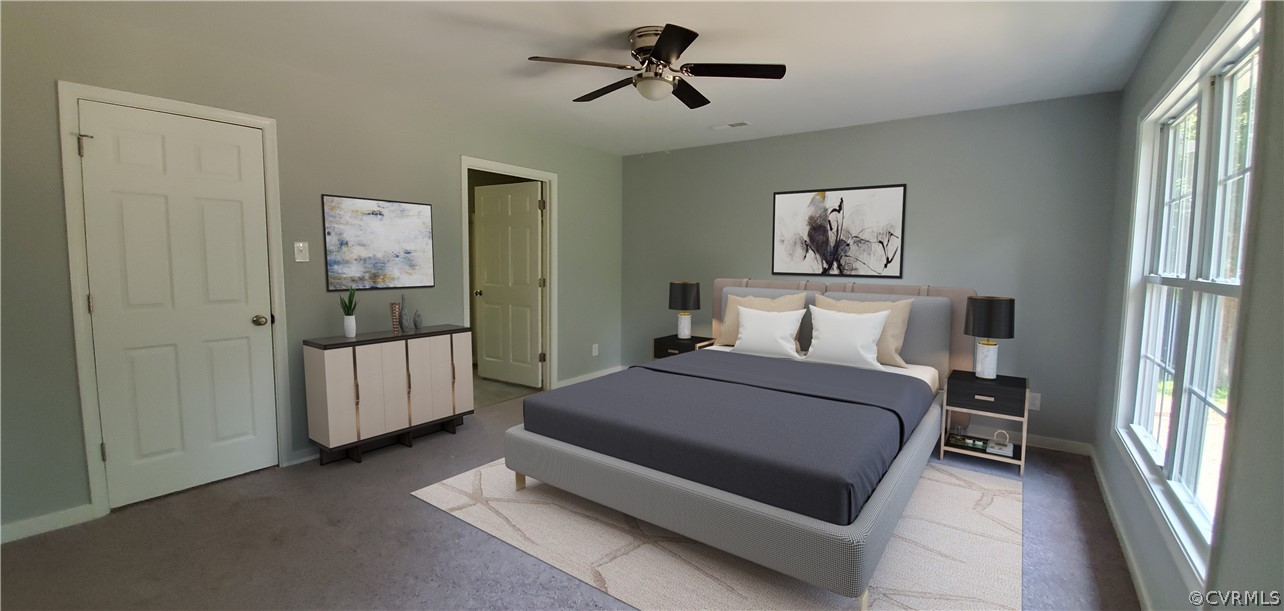 7321 Beach Road Chesterfield, VA 23831 - Photo 11 of 25 a bed room with a bed and a chandelier