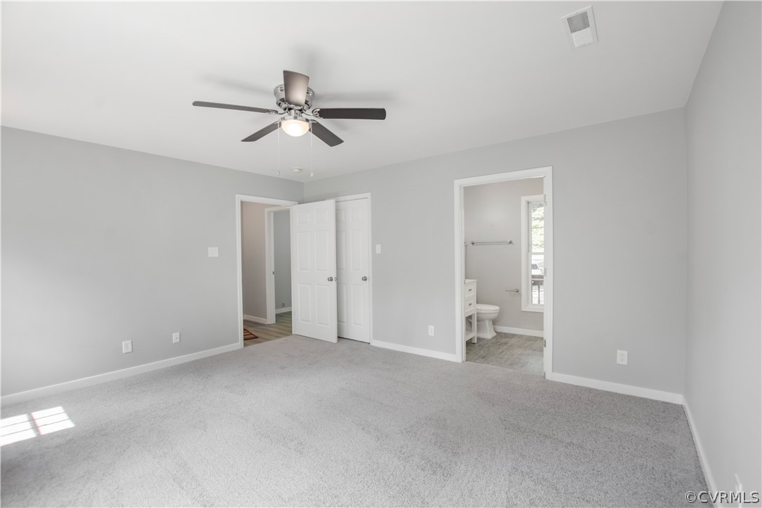 7321 Beach Road Chesterfield, VA 23831 - Photo 13 of 25 an empty room with closet and a chandelier fan