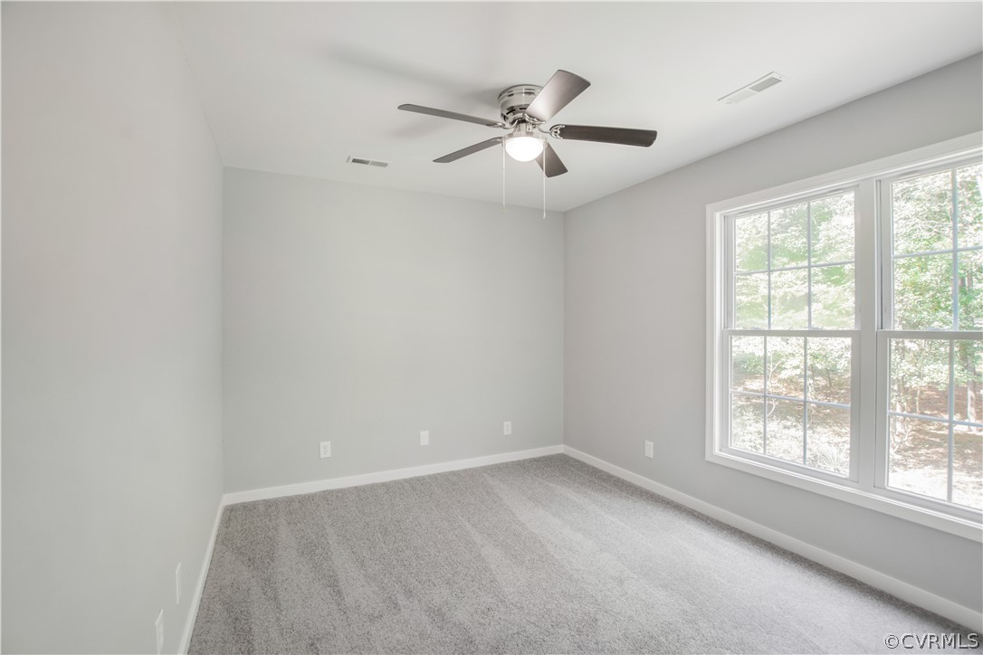 7321 Beach Road Chesterfield, VA 23831 - Photo 16 of 25 an empty room with a window and a fan
