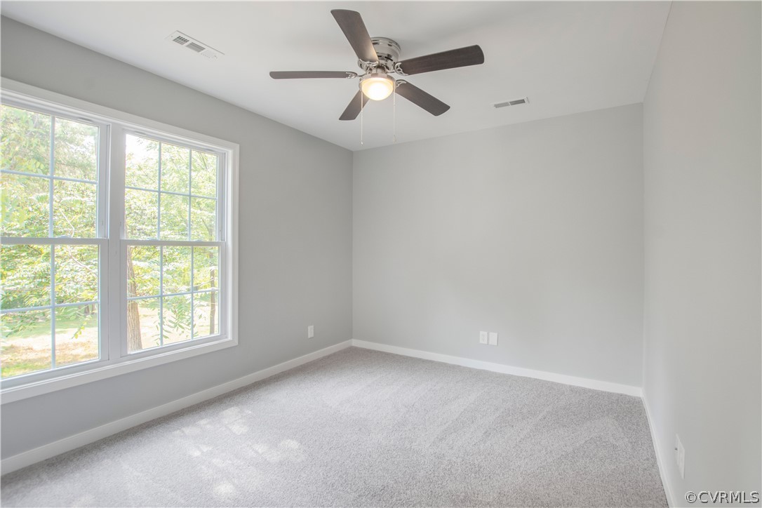 7321 Beach Road Chesterfield, VA 23831 - Photo 20 of 25 an empty room with a window and a fan