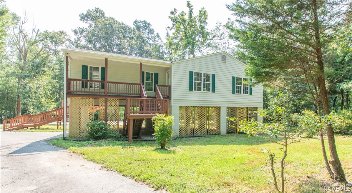 7321 Beach Road Chesterfield, VA 23831 - Photo 2 of 25 a front view of a house with a yard and trees