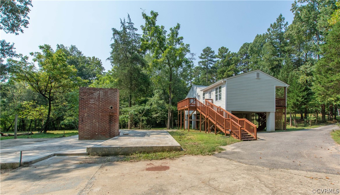 7321 Beach Road Chesterfield, VA 23831 - Photo 24 of 25 a front view of a house with a garden and trees
