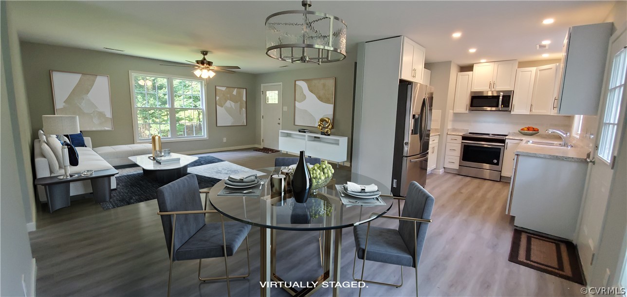 7321 Beach Road Chesterfield, VA 23831 - Photo 6 of 25 a view of a dining room with furniture window and wooden floor