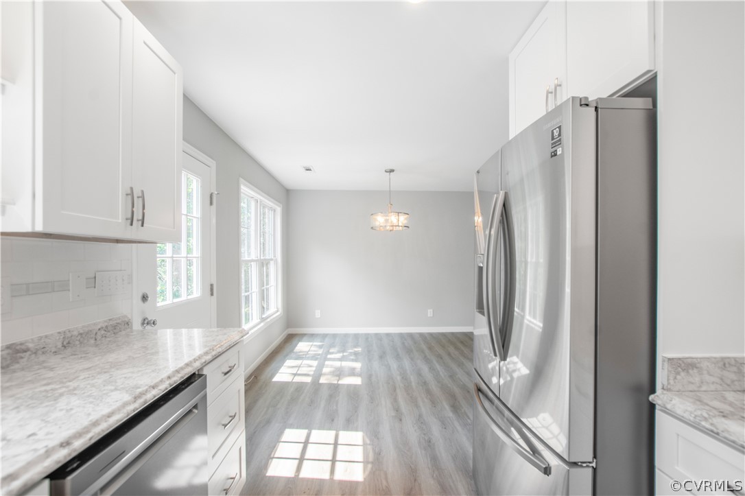 7321 Beach Road Chesterfield, VA 23831 - Photo 8 of 25 a view of a kitchen with wooden floor and staircase