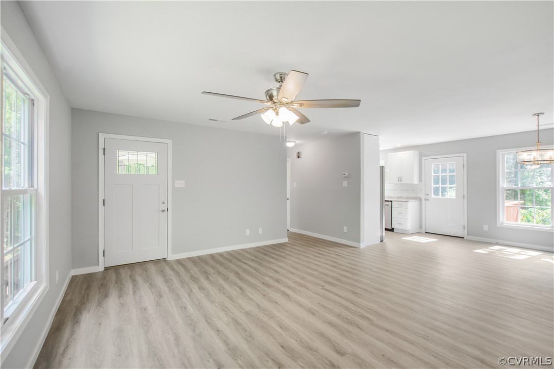 7321 Beach Road Chesterfield, VA 23831 - Photo 9 of 25 wooden floor in an empty room with a window