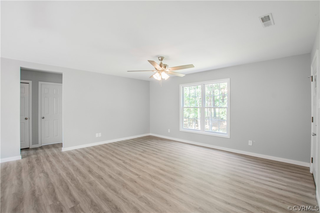 7321 Beach Road Chesterfield, VA 23831 - Photo 10 of 25 wooden floor in an empty room with a window