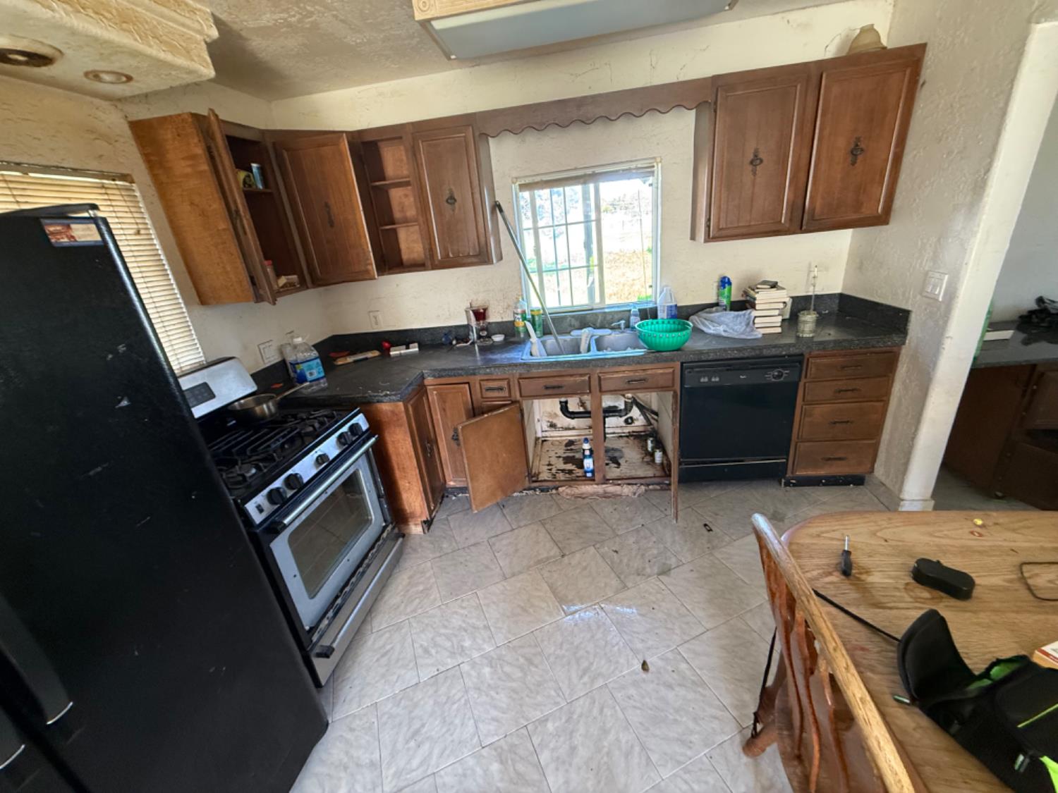 517 Rimmer Avenue Sacramento, CA 95834 - Photo 10 of 20 a kitchen with granite countertop a stove sink and cabinets