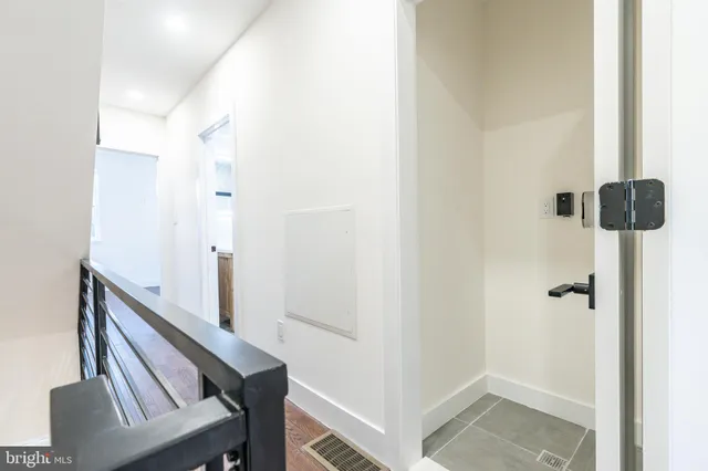 a view of room with wooden floor