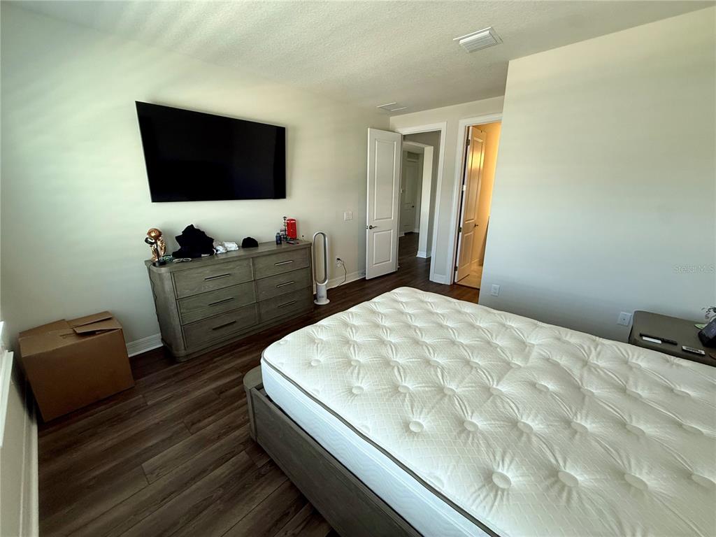8441 Pk Clf Way Orlando, FL 32836 - Photo 45 of 59 a bedroom with a bed and flat screen tv