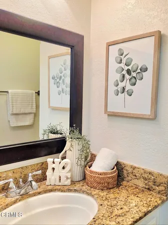 a bedroom with a bed and wall painting