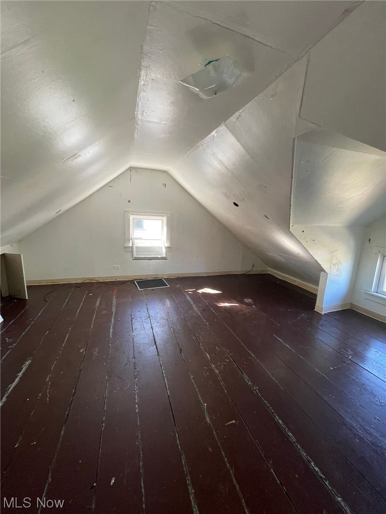 1493 Larchmont Road Cleveland, OH 44110 - Photo 20 of 30 Additional living space with dark hardwood floors and vaulted ceiling