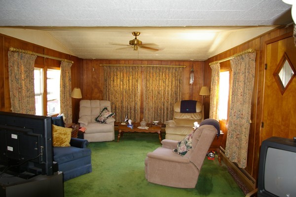 13 Chesapeake Road Holbrook, MA 02343 - Photo 4 of 5 a living room with furniture and a flat screen tv