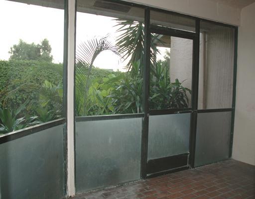 6347 Toulon Drive Boca Raton, FL 33433 - Photo 15 of 24 a view of a glass door with a yard from a balcony
