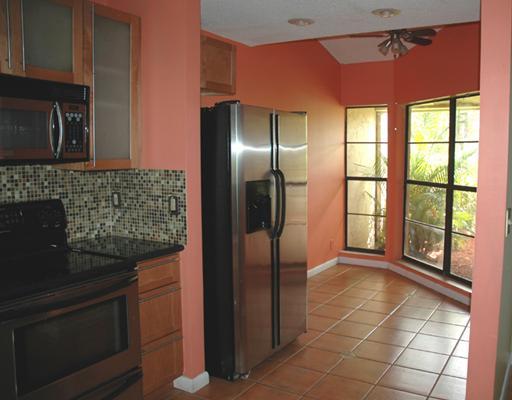 6347 Toulon Drive Boca Raton, FL 33433 - Photo 5 of 24 a kitchen with stainless steel appliances granite countertop a refrigerator and a sink