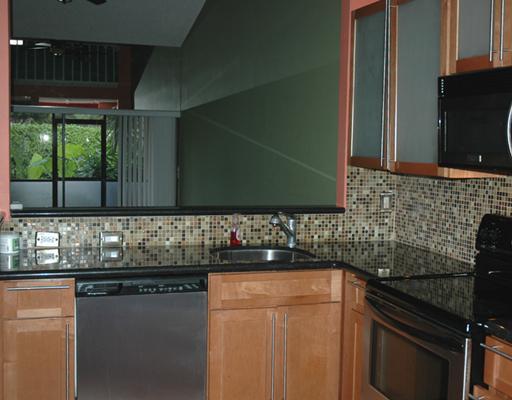 6347 Toulon Drive Boca Raton, FL 33433 - Photo 6 of 24 a kitchen with granite countertop a sink and a stove top oven