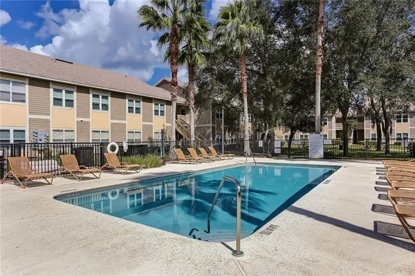 a view of swimming pool with outdoor seating