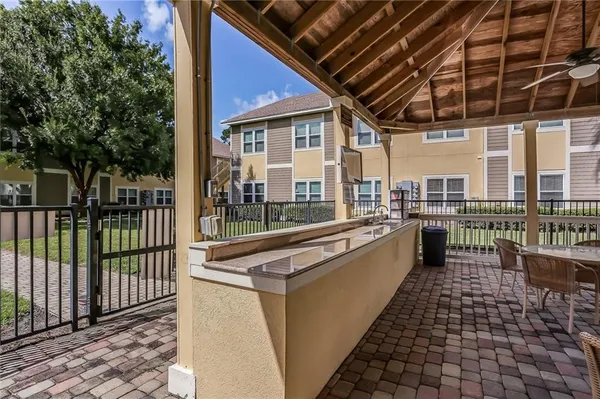 a large white building with swimming pool in front of it