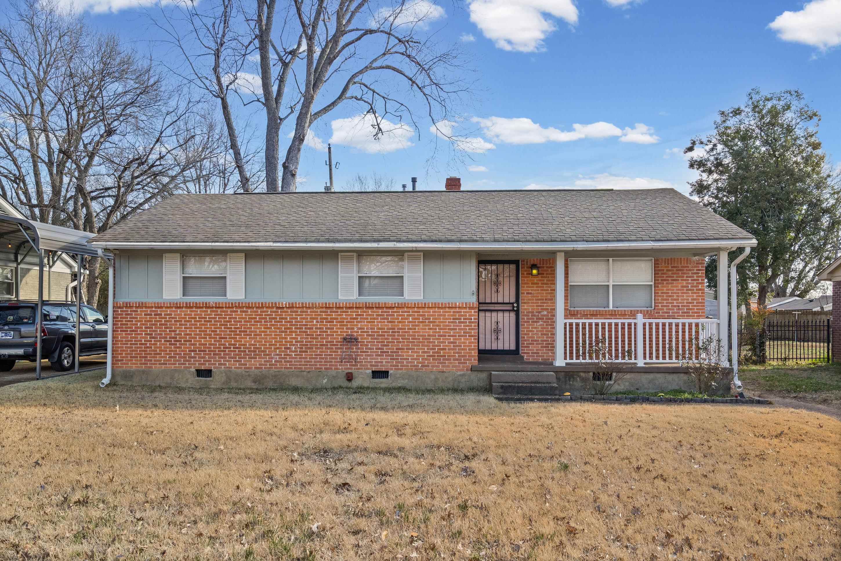 506 McDermitt Road Memphis, TN 38120 - Photo 1 of 29 View of front of home with brick siding, covered porch, and roof with shingles