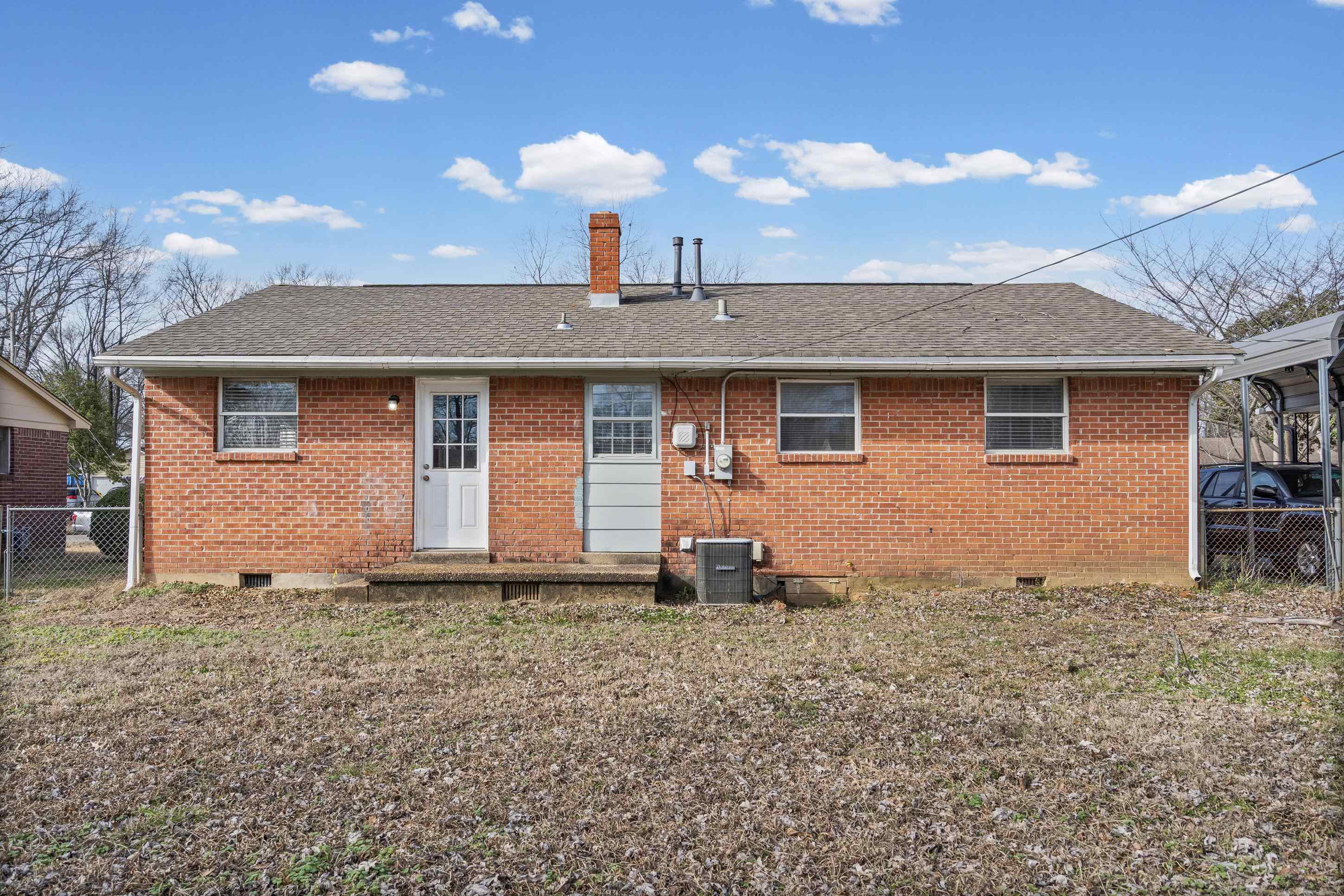 506 McDermitt Road Memphis, TN 38120 - Photo 21 of 29 Rear view of property featuring crawl space, roof with shingles, and brick siding