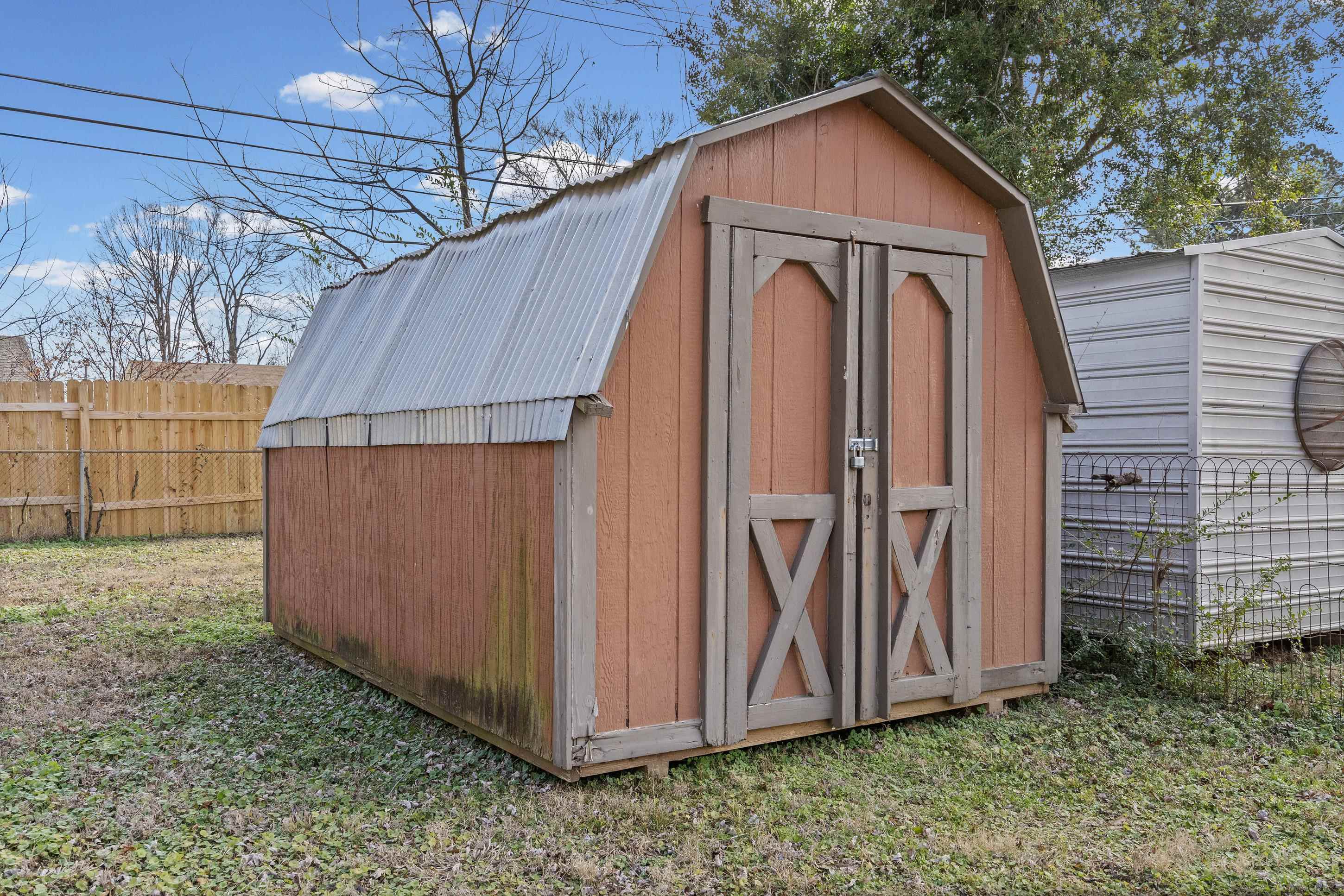 506 McDermitt Road Memphis, TN 38120 - Photo 22 of 29 View of shed with a fenced backyard