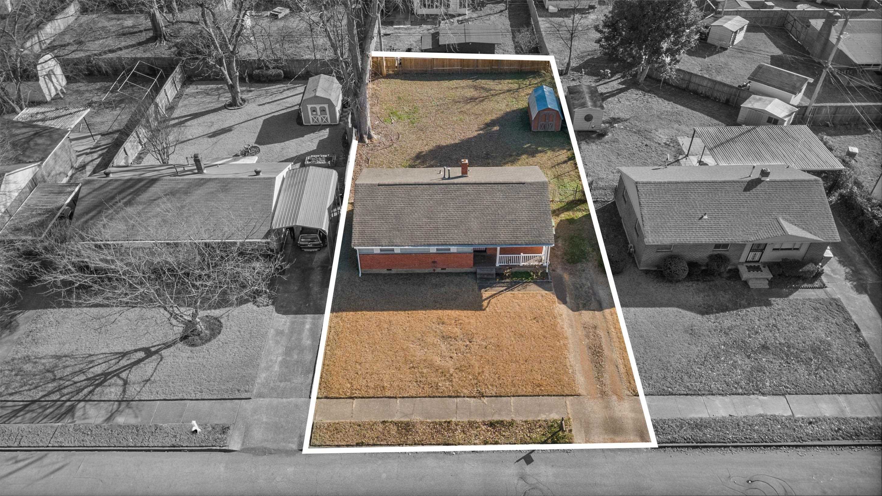 506 McDermitt Road Memphis, TN 38120 - Photo 25 of 29 Aerial perspective of suburban area with property boundaries highlighted