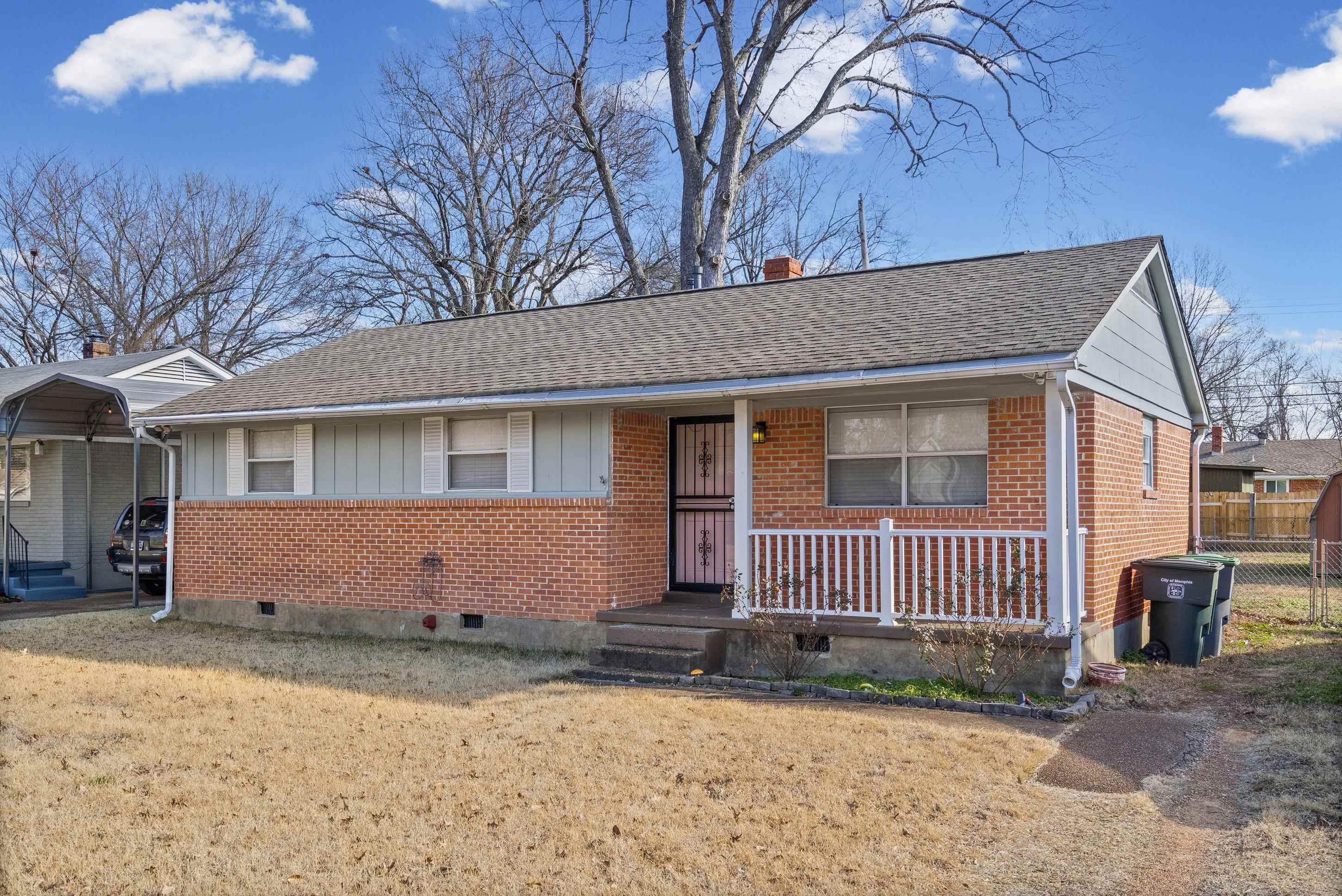 506 McDermitt Road Memphis, TN 38120 - Photo 3 of 29 View of front of house with brick siding, covered porch, a chimney, and roof with shingles