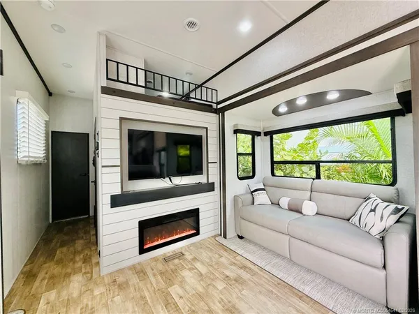 a living room with furniture and a large window