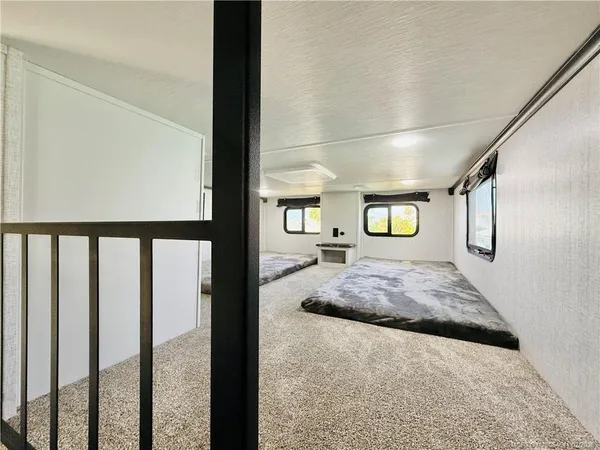 a view of a house with a wooden deck