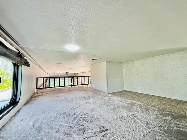 a view of a patio with a table and chairs