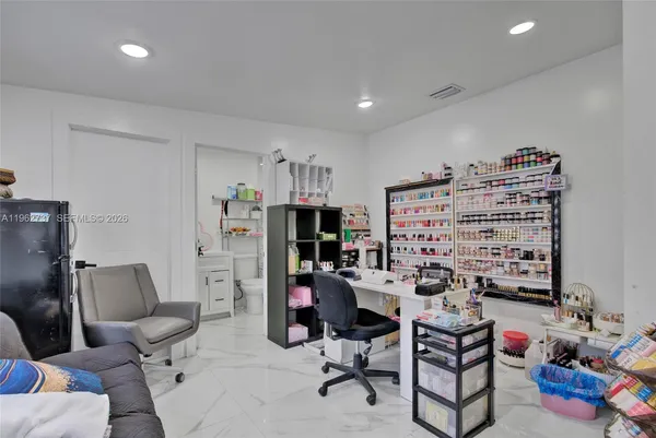 a view of a workspace with furniture