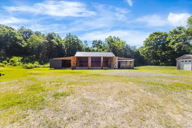 a swimming pool with trees in the background
