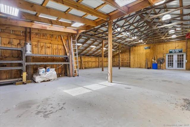 a view of a room with wooden ceiling