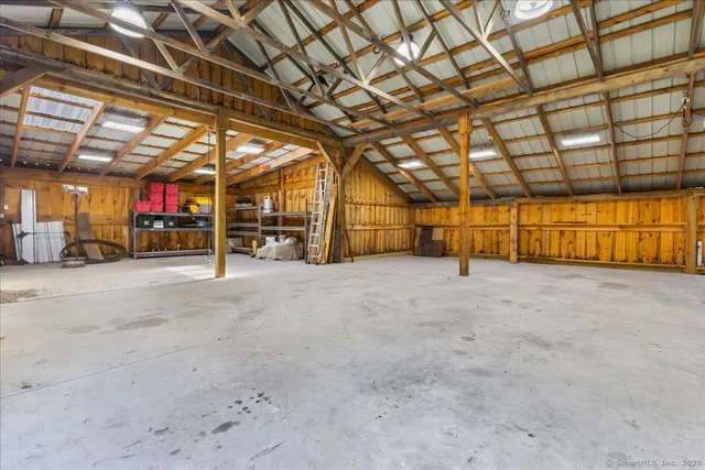 a view of empty room with wooden ceiling