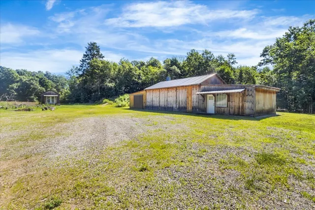 a view of a swimming pool with an outdoor space and seating area