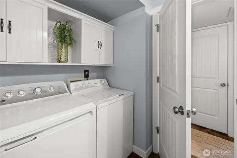 a view of storage and utility room with washer and dryer