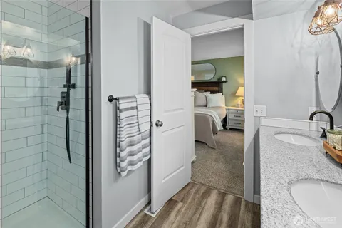 a bathroom with a granite countertop shower