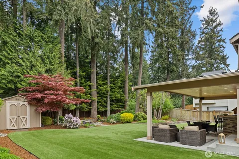 a view of a patio with couches chairs and potted plants