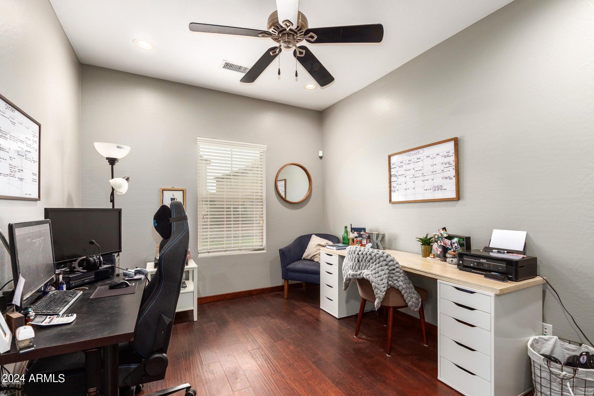 2217 West Kathleen Road Phoenix, AZ 85023 - Photo 13 of 42 a view of a workspace with furniture and a window