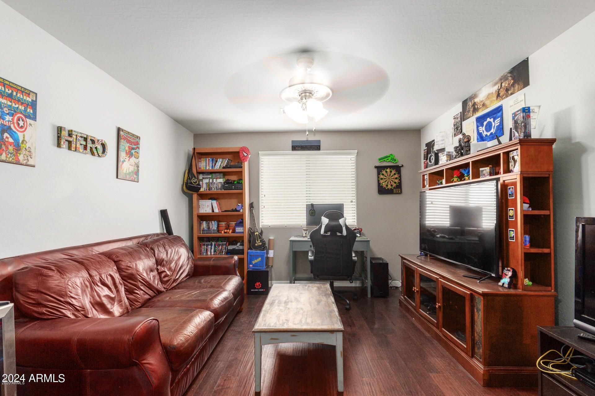 2217 West Kathleen Road Phoenix, AZ 85023 - Photo 19 of 42 a living room with furniture and a flat screen tv