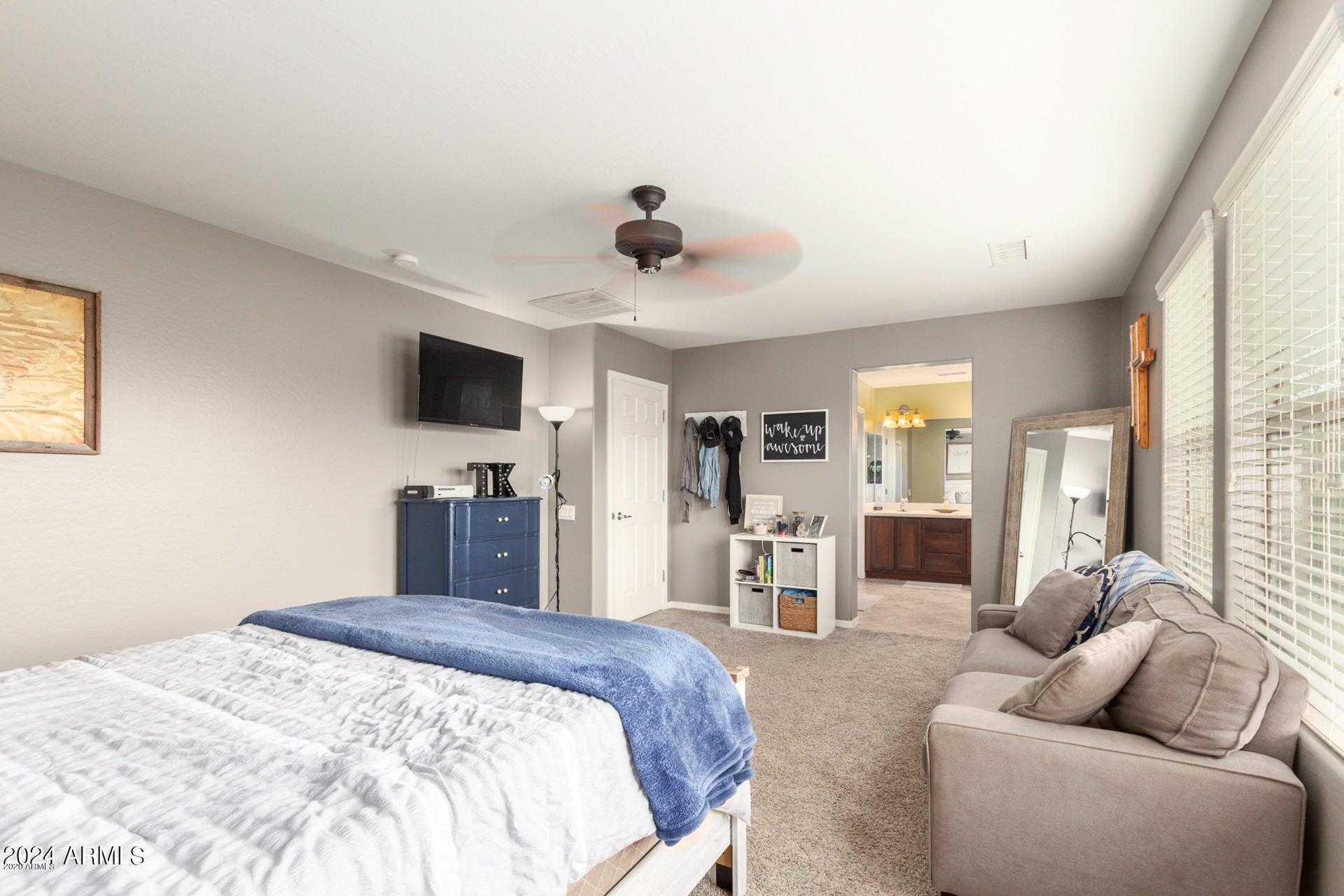 2217 West Kathleen Road Phoenix, AZ 85023 - Photo 20 of 42 a bedroom with furniture and a flat screen tv