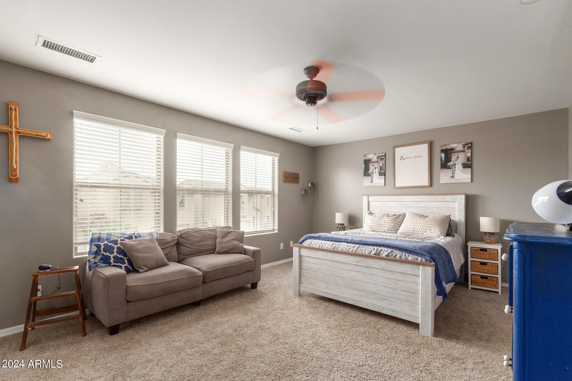 2217 West Kathleen Road Phoenix, AZ 85023 - Photo 21 of 42 a spacious bedroom with a bed and a large window