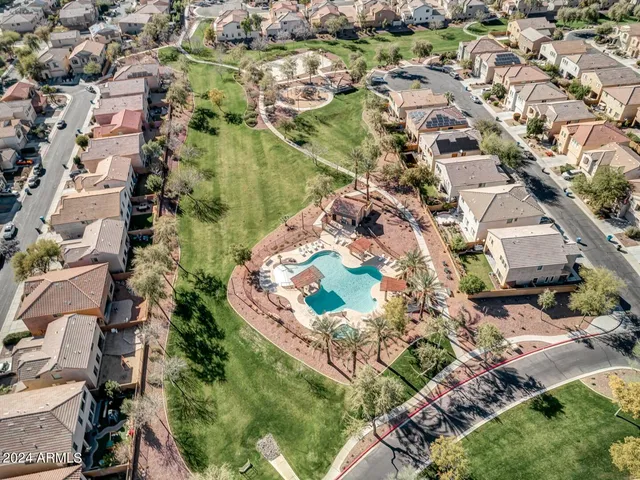 an aerial view of residential houses with outdoor space