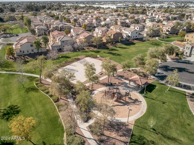 an aerial view of a house with yard swimming pool and outdoor seating