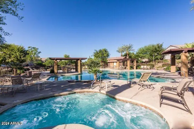 a view of a swimming pool with a patio