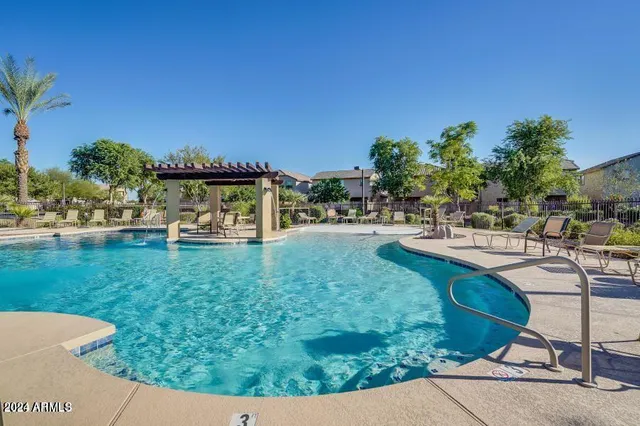 a view of a table and chairs in the garden